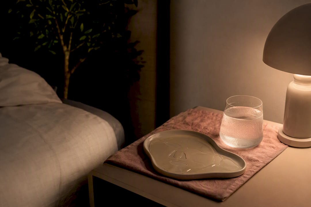 Nightstand with hydrogel mask and water glass
